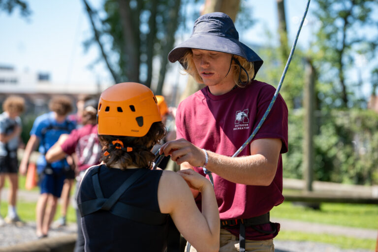 First year student getting ready to climb McMaster climbing tower