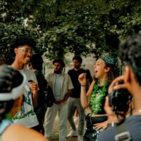 Faculty representatives with microphones getting their picture taken.