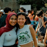 Two faculty representatives smiling at the camera.
