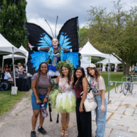 First year students posing with performers at 'Community Connections'.