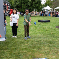 First-year student tossing a bean bag.