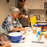 McMaster Welcome week representative rolling dough.