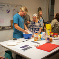 First year students baking with McMaster representatives.