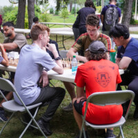First-years playing chess at a table.