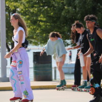Faculty representatives rollerblading at Pier 8.