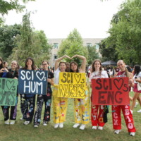 Different faculty representatives holding signs that read 'SCI Heart's 1st YRS','SCI Heart's HUM', 'SCI Heart's NURSES', SCI Heart's ENG'.