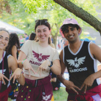 Representatives making "M" with their fingers wearing shirts that say 'MSU MAROONS'.